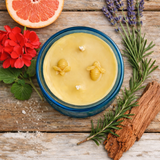 Hand-poured Spring Clean beeswax candle in amber glass jar
