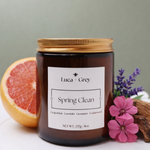 Hand-poured Spring Clean beeswax candle in amber glass jar