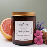 Hand-poured Spring Clean beeswax candle in amber glass jar